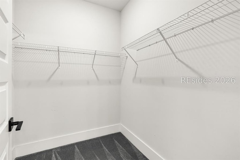 Tucked away on a private, wooded lot, this stunning single-story - photo 37