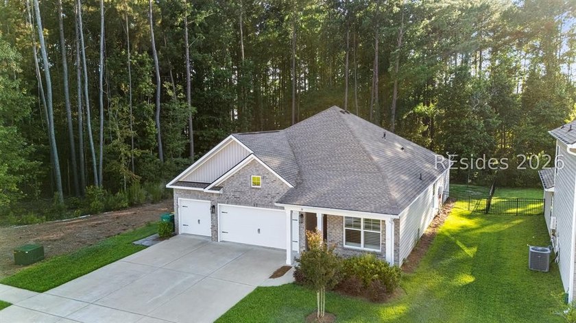 Tucked away on a private, wooded lot, this stunning single-story - photo 40