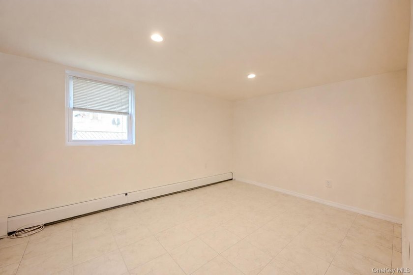 Welcome to this beautifully renovated raised ranch in Long - photo 18