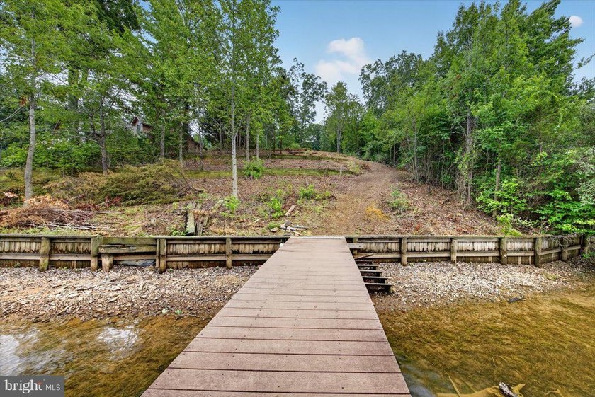 Remarkable waterfront lot! 3 stall Boathouse with huge sunning - photo 22