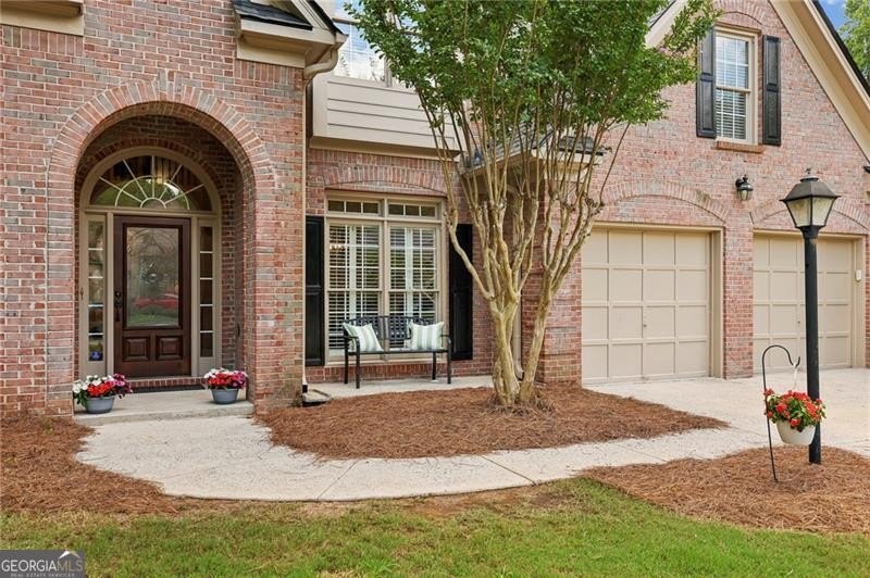 Welcome home to 6930 Olde Atlanta Parkway, where refined living - photo 4