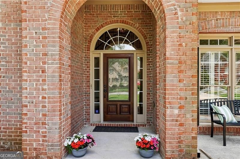 Welcome home to 6930 Olde Atlanta Parkway, where refined living - photo 5