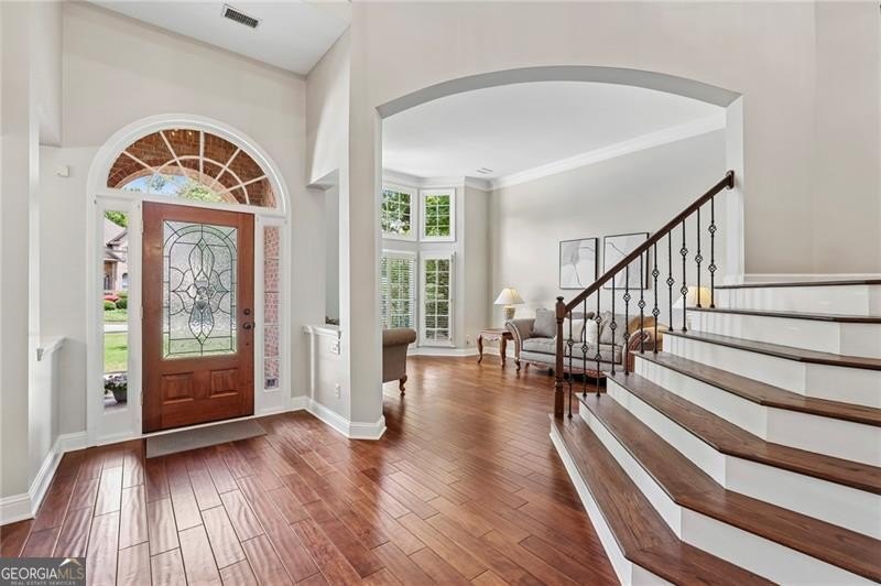 Welcome home to 6930 Olde Atlanta Parkway, where refined living - photo 9