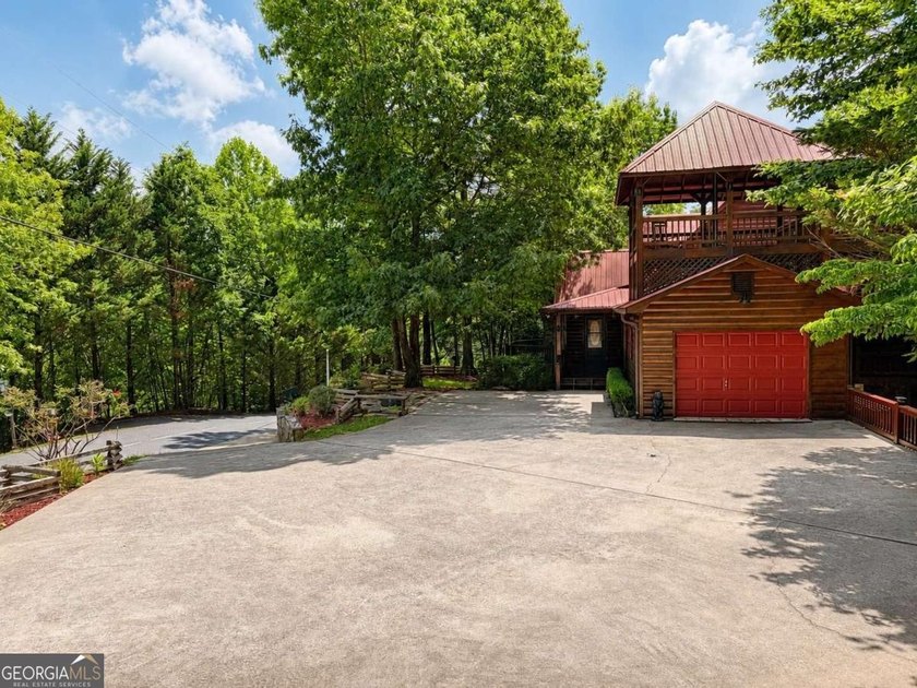 Tucked into a private wooded setting on top of the mountain in - photo 6