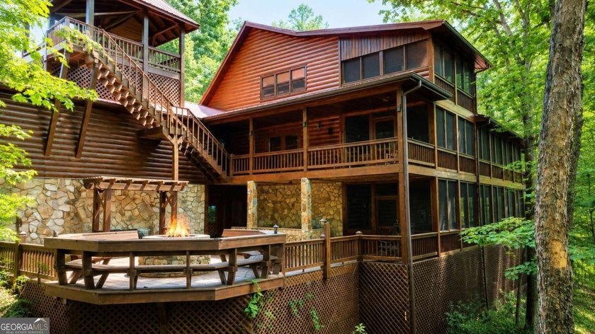 Tucked into a private wooded setting on top of the mountain in - photo 7