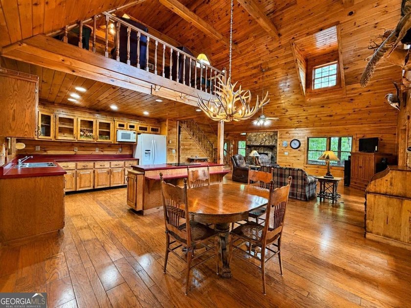 Tucked into a private wooded setting on top of the mountain in - photo 8
