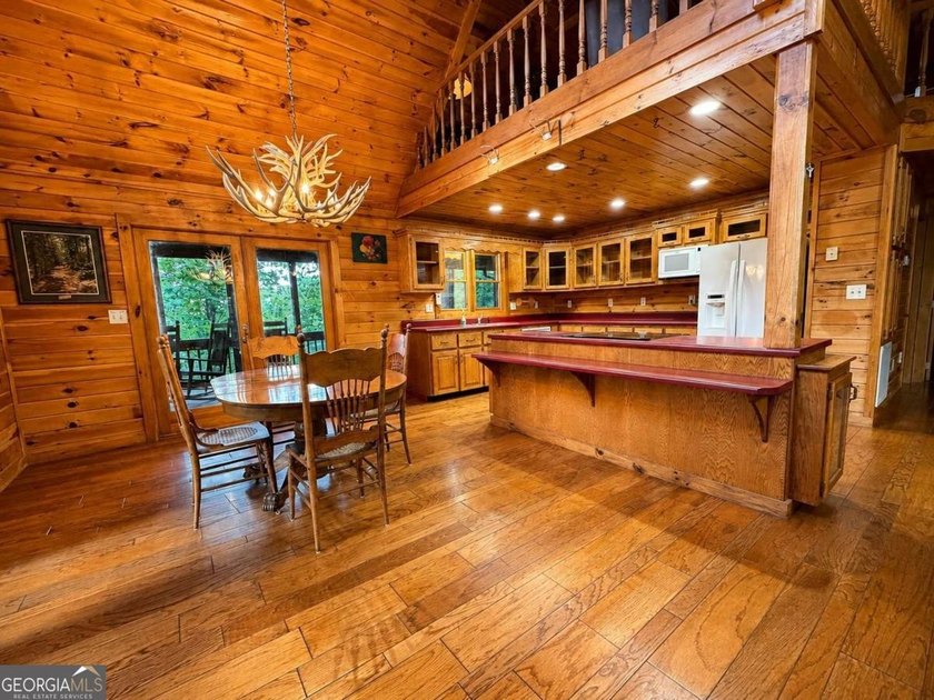 Tucked into a private wooded setting on top of the mountain in - photo 10