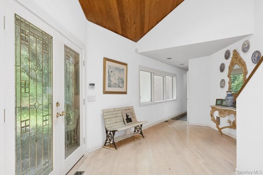 Tucked away on 1.4 acres of lush, landscaped grounds, this - photo 4