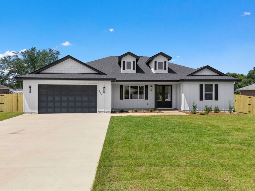This remarkable new construction home by Carr Custom Homes is - photo 2