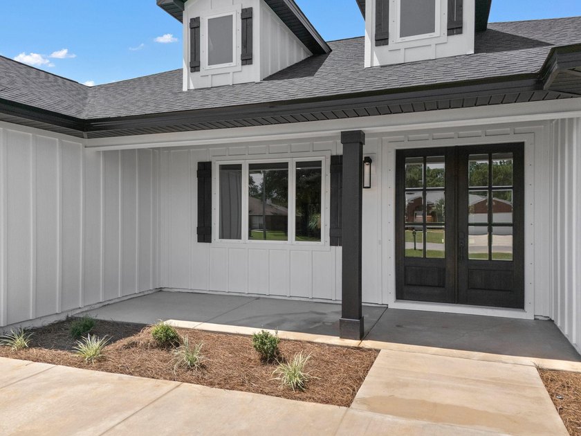 This remarkable new construction home by Carr Custom Homes is - photo 3