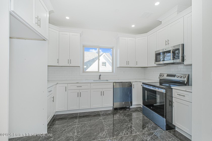 Brand-new 6 over 6 two-family home located in the desirable - photo 8