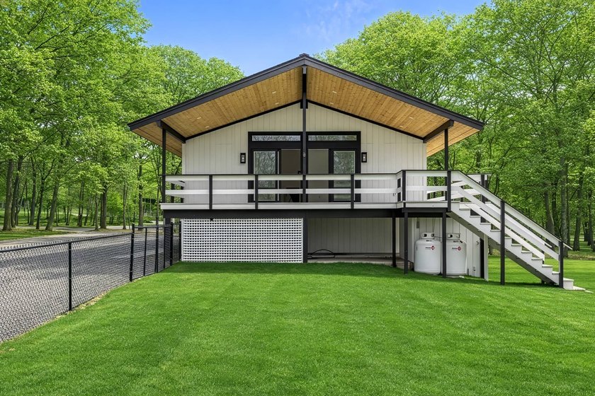 Tucked away on a full acre in the heart of Hampton Bays, this - photo 22