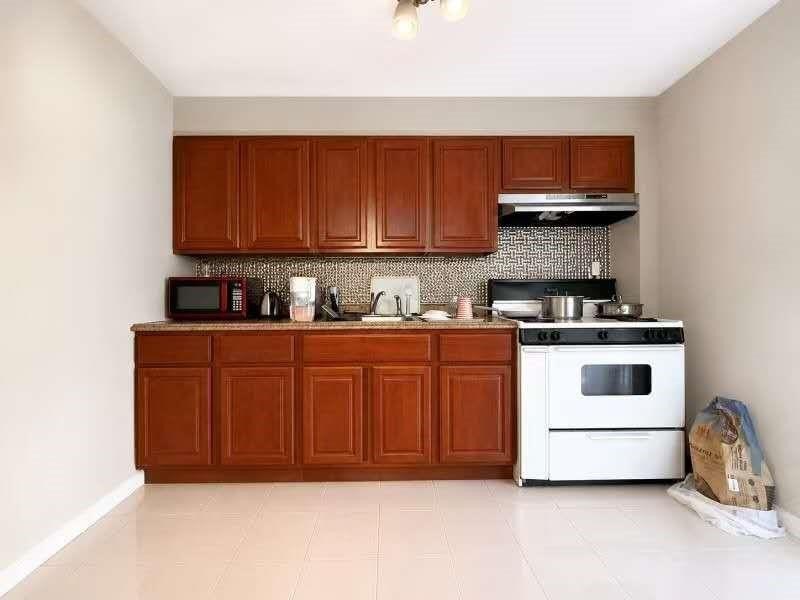 Exceptional opportunity to own a two-family brick home in the - photo 3