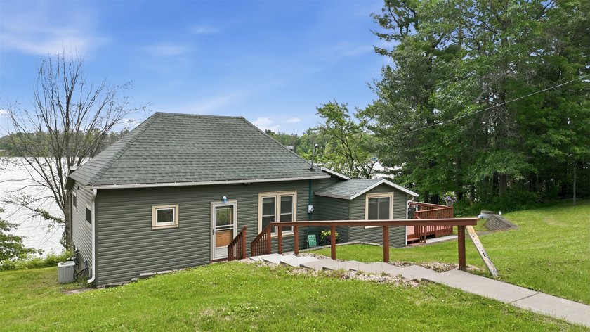 Enjoy front-row lake living on the Chetek Chain at this inviting - photo 8
