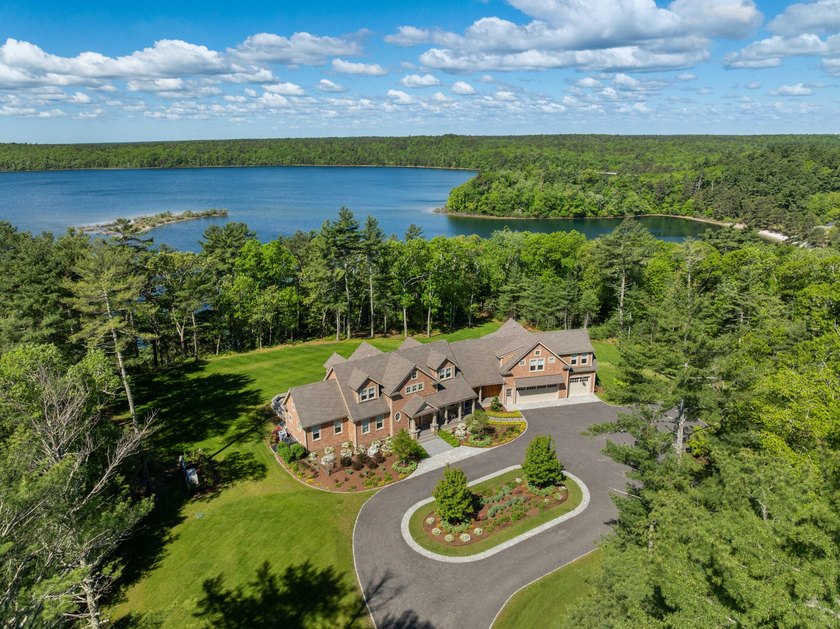 Experience unparalleled privacy in this gated, fully fenced - photo 2