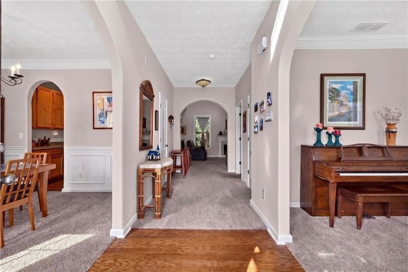 Tucked away on a private wooded homesite, this beautifully - photo 3