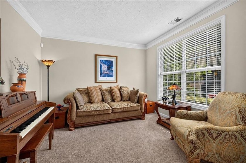 Tucked away on a private wooded homesite, this beautifully - photo 4