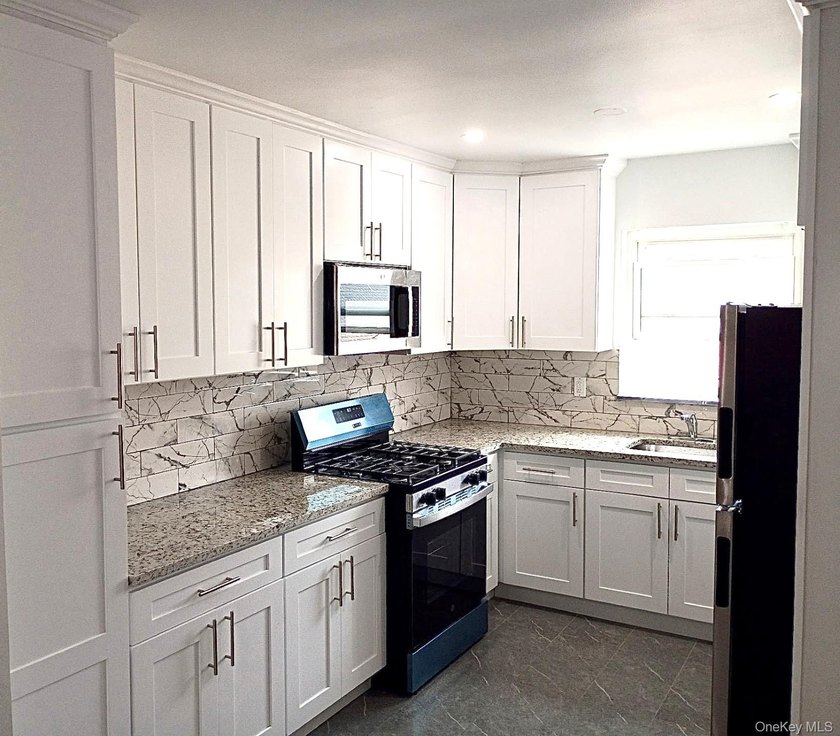Beautifully updated two-family home in the Morris Park section - photo 9