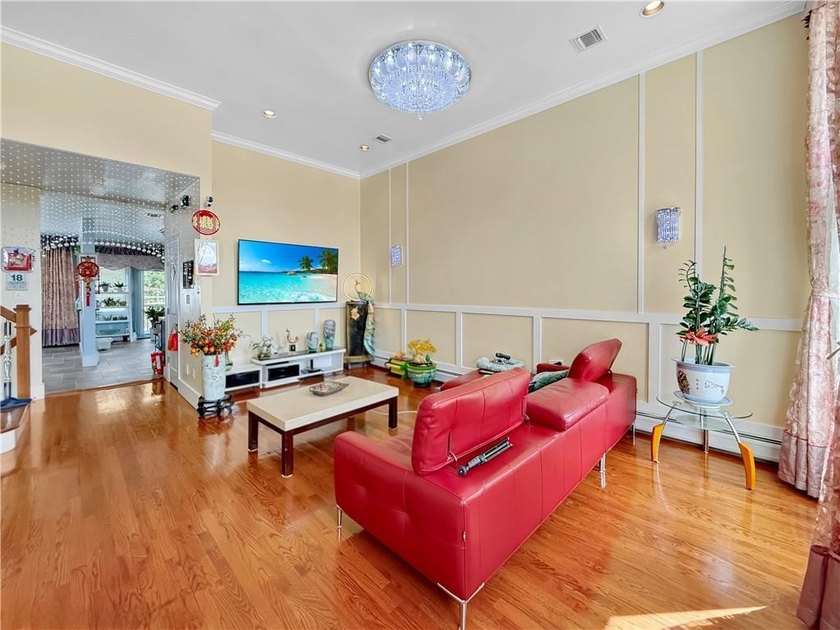 Built in 2013, this detached two-family home with brick front - photo 6