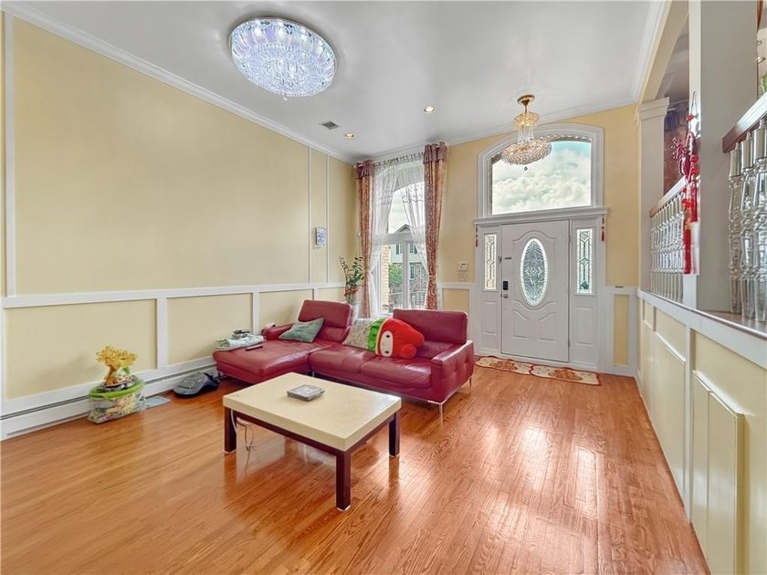 Built in 2013, this detached two-family home with brick front - photo 7