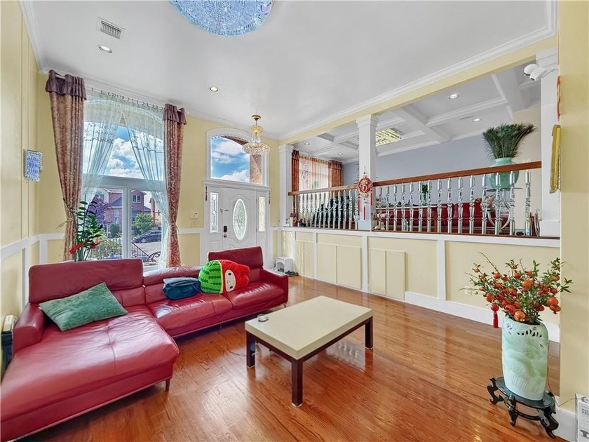 Built in 2013, this detached two-family home with brick front - photo 9