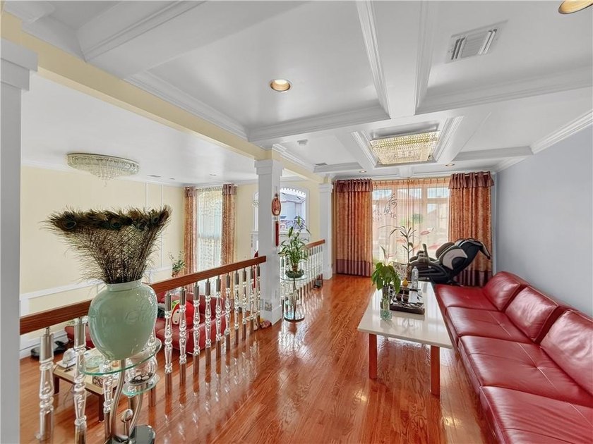 Built in 2013, this detached two-family home with brick front - photo 10