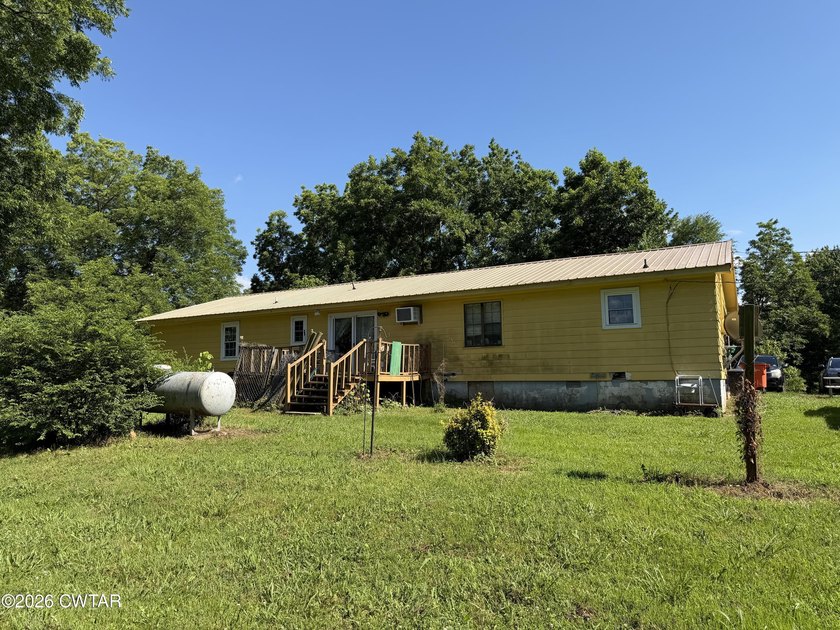Check out this 3 bedroom, ranch-style home with a barn, shop - photo 3