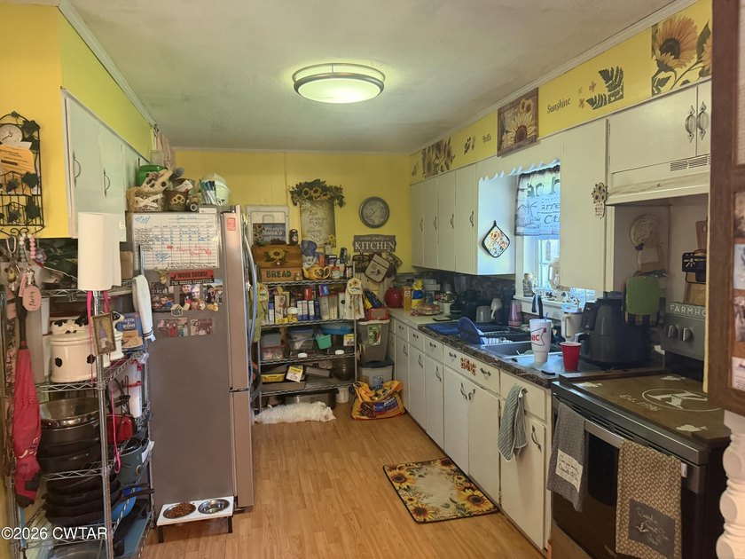 Check out this 3 bedroom, ranch-style home with a barn, shop - photo 4