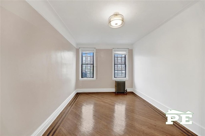Welcome to 1392 Troy Avenue, a solid brick two-family home in - photo 8