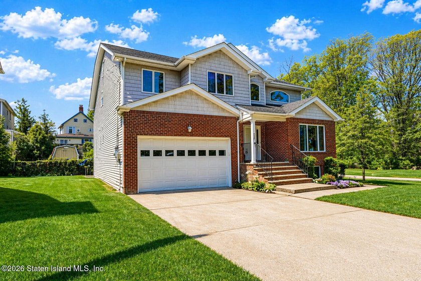Welcome to this stunning 2-family colonial tucked away on a - photo 3