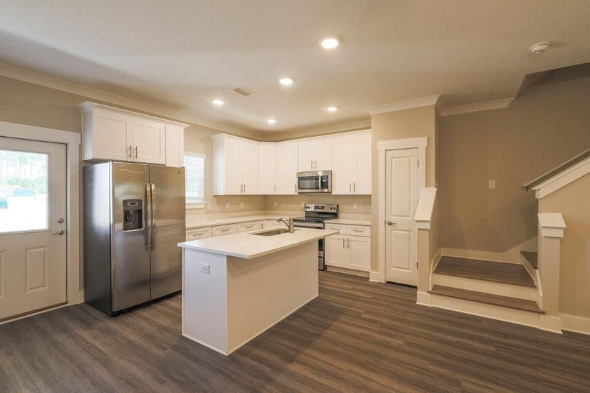 This Savannah floor plan features 3 bedrooms, 2.5 baths, and a - photo 3
