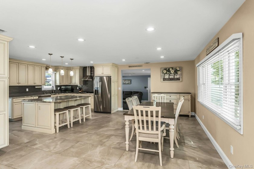 Expanded home featuring a gourmet eat-in kitchen with center - photo 6