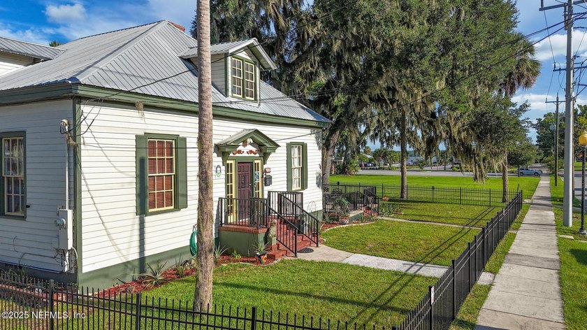 This home offers the best of both worlds, historic character - photo 2