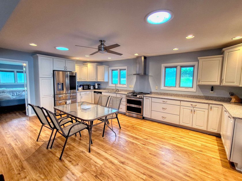 Lake life just got an upgrade. This remodeled waterfront home at - photo 3