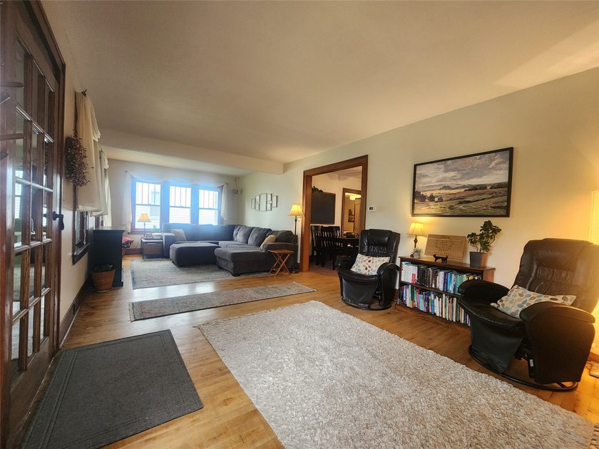 Nestled in a quiet, tree-lined neighborhood, this three-bedroom - photo 7