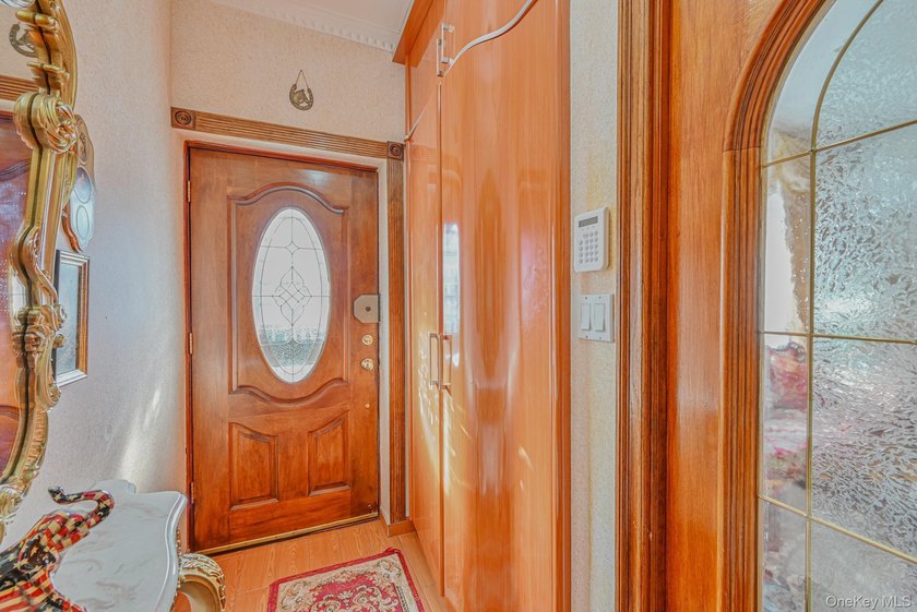 Welcome to this beautifully renovated legal two-family brick - photo 3
