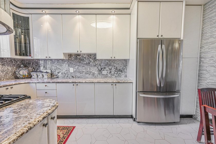Welcome to this beautifully renovated legal two-family brick - photo 7