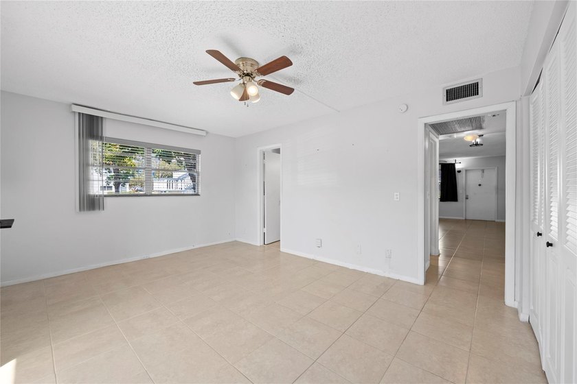 Spacious 1-bedroom, 1.5-bathroom condo conveniently located on - photo 16