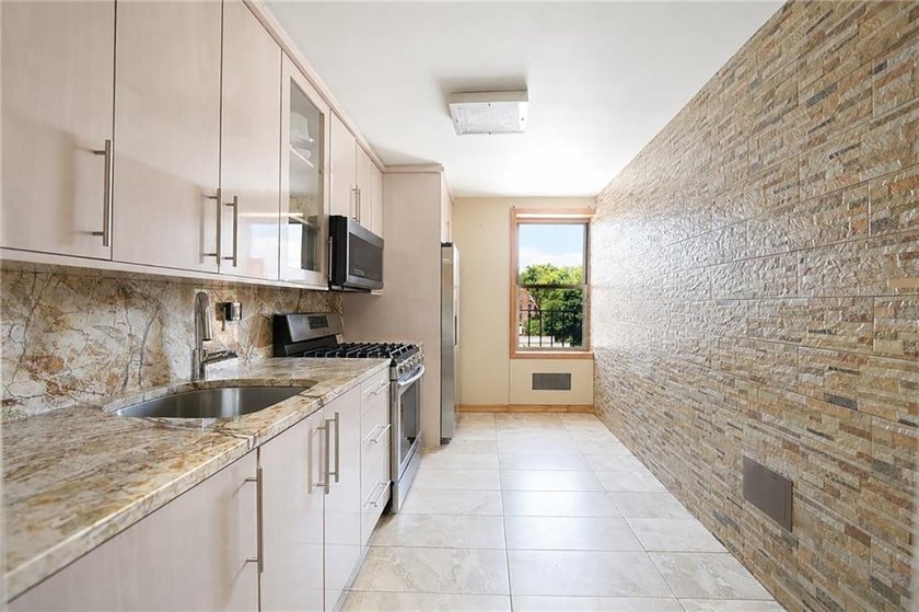 Welcome to this fully renovated luxury residence in the heart of - photo 2