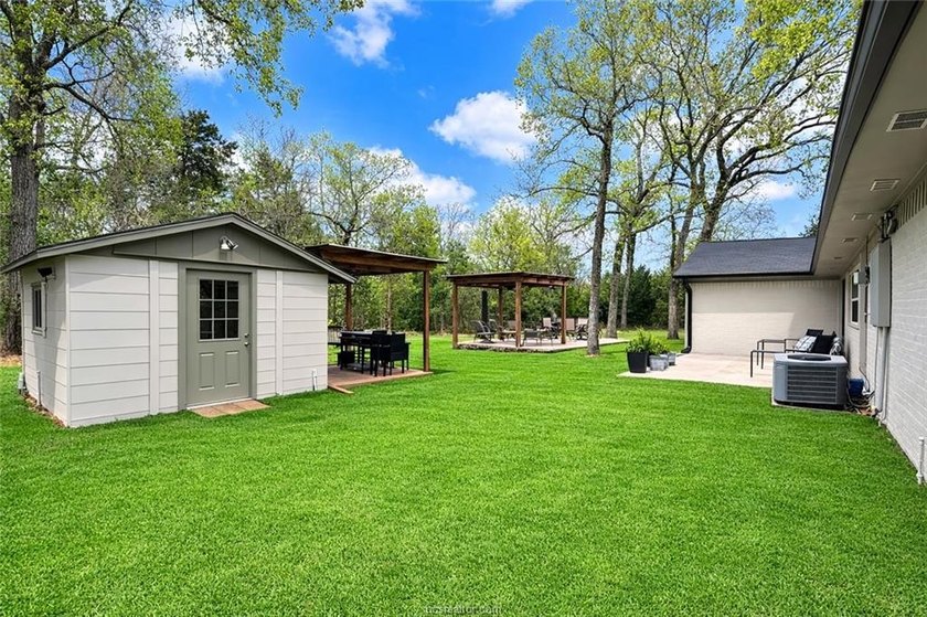 Set on nearly an acre of land, this one-of-a-kind property - photo 3