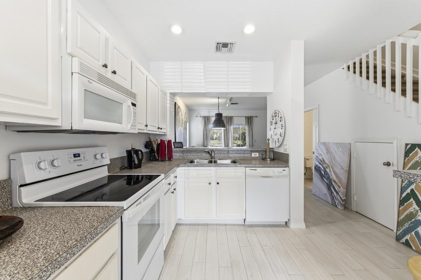 Beautiful two-story corner townhouse offering two bedrooms and - photo 8