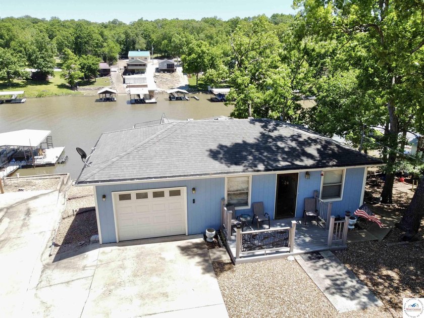 Located on a quiet cove on the Lake of the Ozarks in a very - photo 2