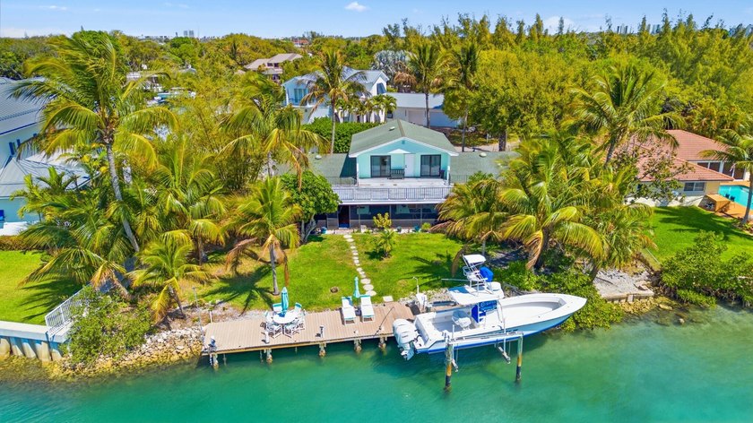 Discover Your Hidden Paradise! This charming riverfront property - photo 6
