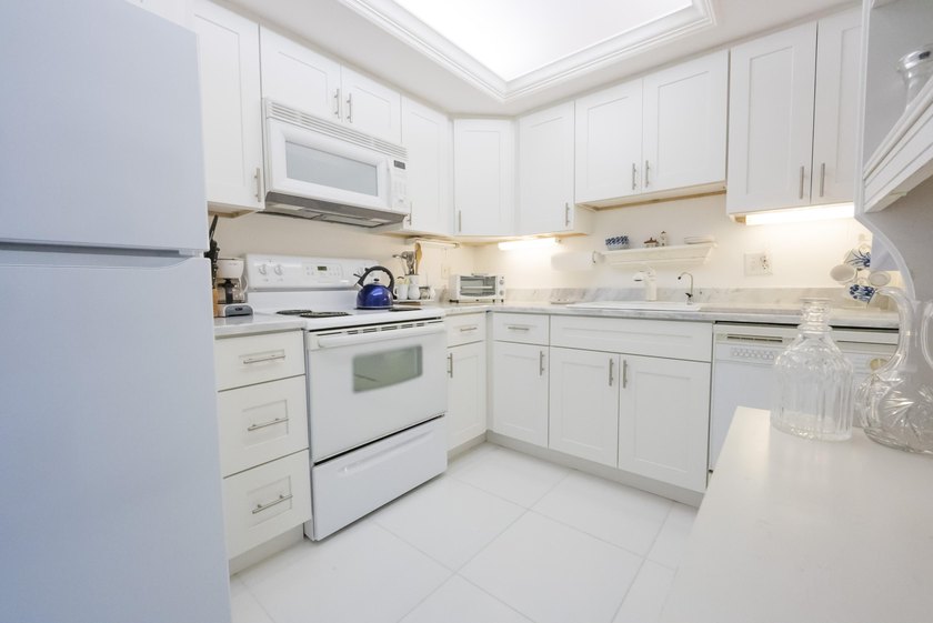 Brand new AC and HWH, 11/2025. Welcome to one of North Palm - photo 8