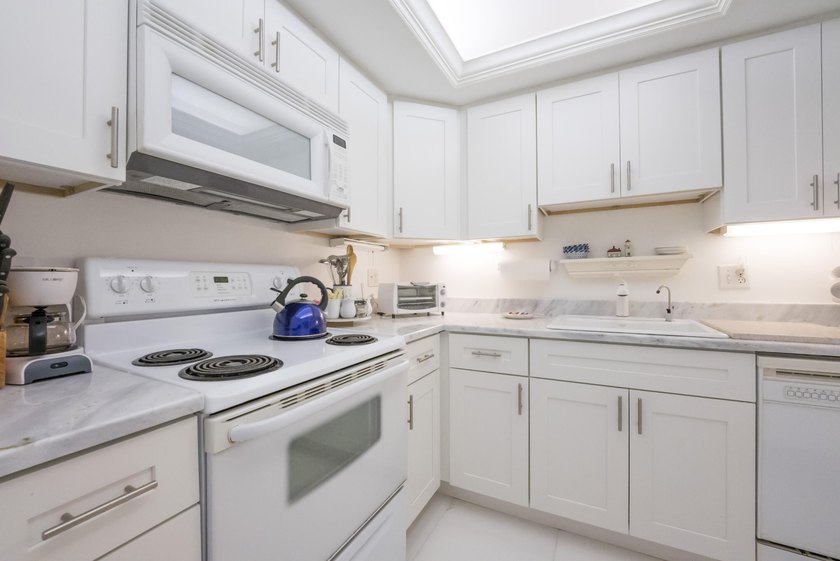Brand new AC and HWH, 11/2025. Welcome to one of North Palm - photo 9