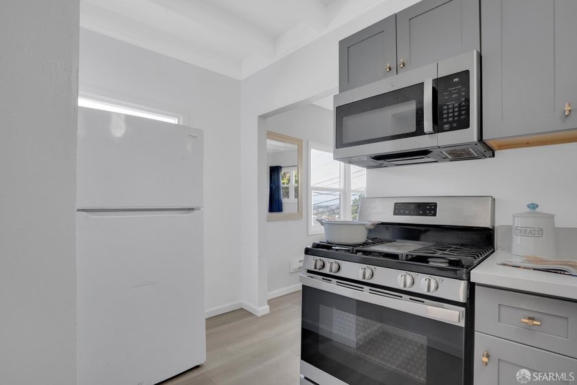 This well-maintained triplex presents a rare opportunity to own - photo 6