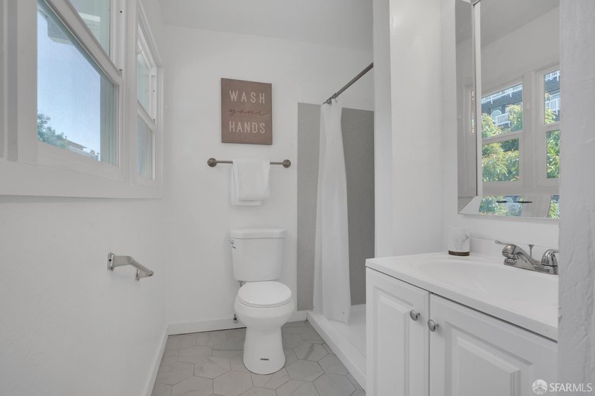 This well-maintained triplex presents a rare opportunity to own - photo 7