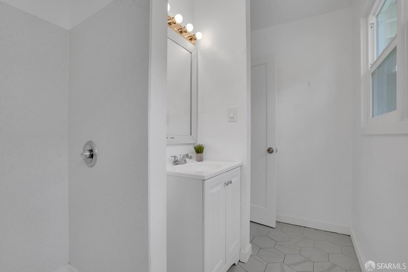 This well-maintained triplex presents a rare opportunity to own - photo 8