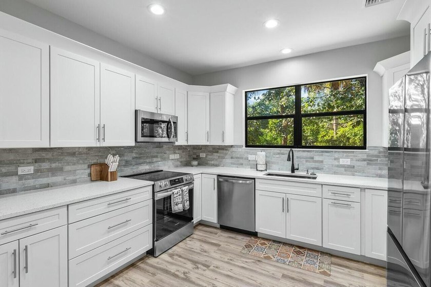 One of Kind 2 Homes, Beautiful treed acre lot in Desirable - photo 45