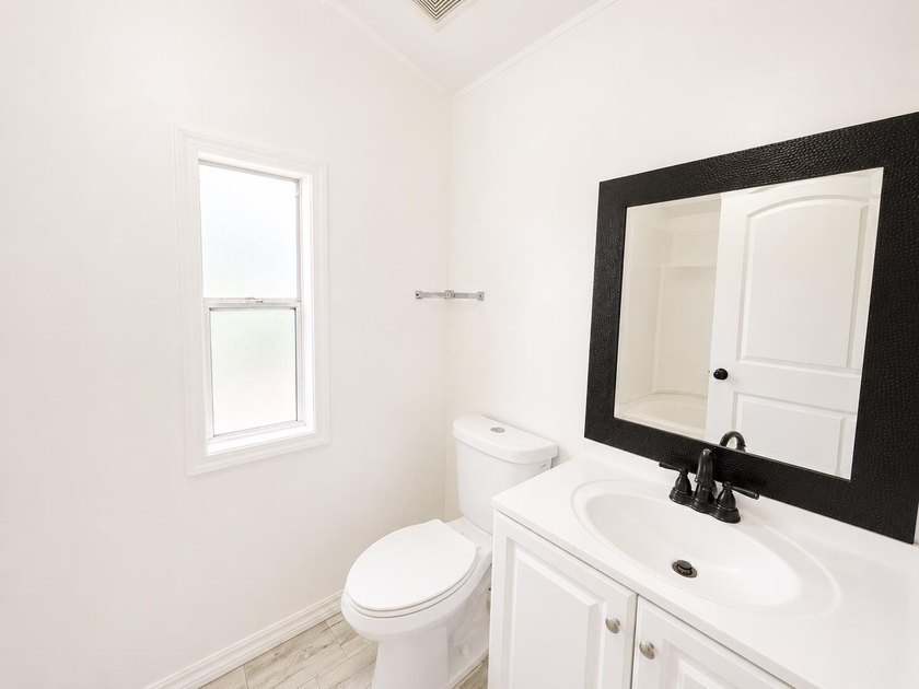 This is a charming, move-in-ready mobile home located in a - photo 13